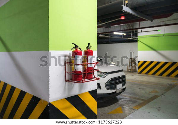 Fire\
extinguisher in underground basement car\
parking