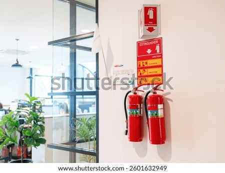Fire extinguishers and evacuation flags are installed at the office.
