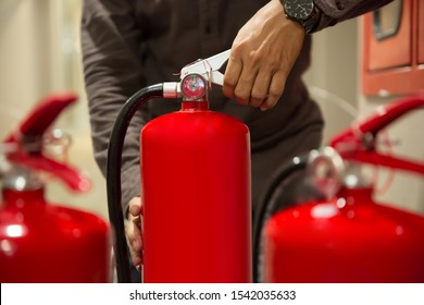 Fire Extinguisherscloseup Engineers Hands Squeezing Handle Stock Photo ...