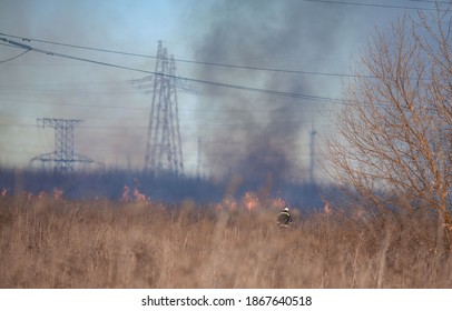 Fire In A Field Near A Power Line