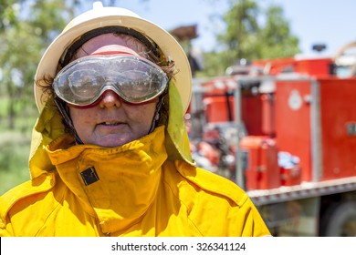 Fire Fighter In Protective Clothing