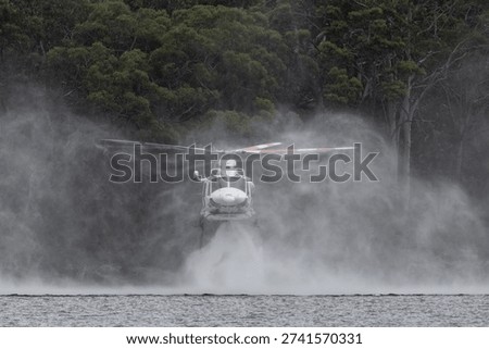 Fire fighting helicopter hovering over water