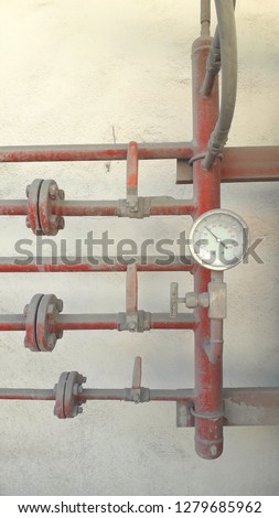 Fire fighting system red pipe have manual valves and pressure gauge to storage tank in factory