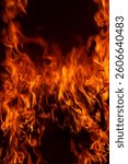 Fire flame background. Hell bonfire. Texture of fire on a black background. Abstract fire flame background. Large burning fire