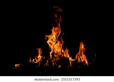Fire flame background. Hell bonfire. Texture of fire on a black background. Abstract fire flame background. Large burning fire.