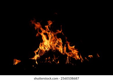 Fire flame background. Hell bonfire. Texture of fire on a black background. Abstract fire flame background. Large burning fire.