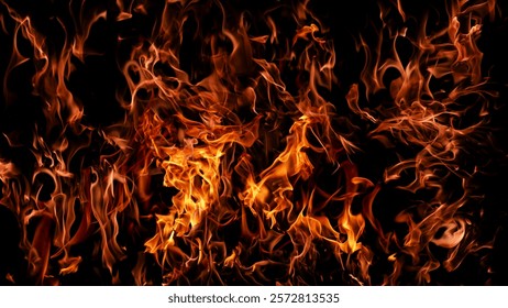 Fire flame background. Hell bonfire. Texture of fire on a black background. Abstract fire flame background. Large burning fire.