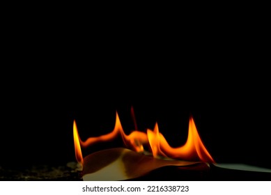 Fire flame burning paper on black background - Shutterstock ID 2216338723