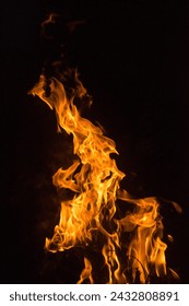 Fire flame element without smoke in red orange yellow color hot with dark background texture closeup detail abstract photography