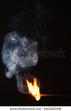 fire and flame with a match