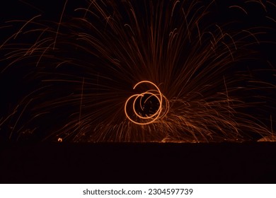 Fire and Flame performance,Fire dancers Swing fire dancing show fire show on the beach dance man juggling with fire.