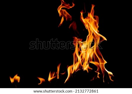 Fire flame texture. Burning material backdrop. Burn effect pattern. Blaze and torch wallpaper. Heat and haze backdrop. Exploison and hot background.