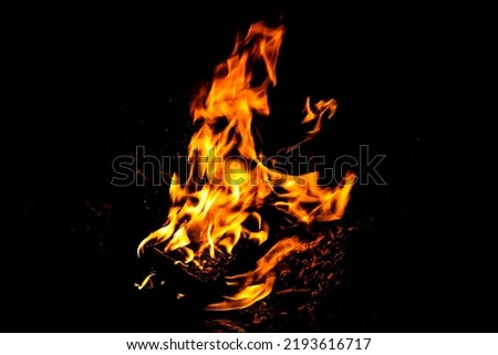 Fire flame texture. Burning material backdrop. Burn effect pattern. Blaze and torch wallpaper. Heat and haze backdrop. Exploison and hot background.