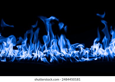 Fire flames. Hellflame, devil's mouth. GAS fire banner. A background of scalding blue flames. Firestorm. Fire burning. Bright burning flames on a black background.