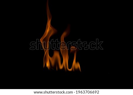 The fire flames is powerful , Shoot in a studio with a black background. 