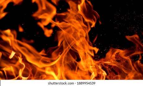 Fire flames with sparks on a black background, close-up - Powered by Shutterstock