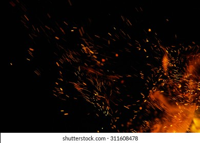 fire flames with sparks on a black background - Shutterstock ID 311608478