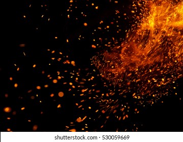 fire flames with sparks on a black background - Shutterstock ID 530059669