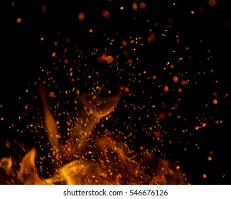 fire flames with sparks on a black background - Shutterstock ID 546676126