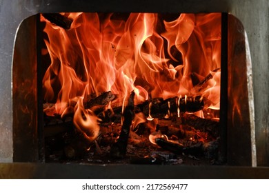 Fire Flames From A Wood Stove Fire Isolated On A Black Background