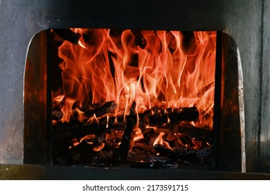 Fire Flames From A Wood Stove Fire Isolated On A Black Background