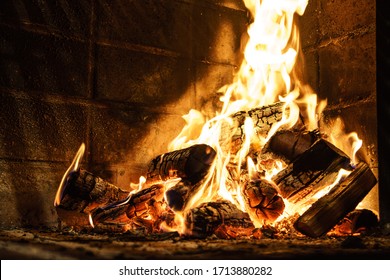 Fire generated by burning firewood in a brick grill