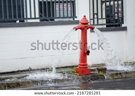 Fire hydrant being flushed by for maintenance. Fire hydrant leaking.