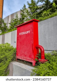 Fire hydrant box for emergency, red fire hydrant for fire anticipations. Close-up shots outdoors.