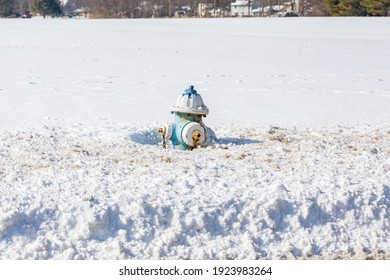 Fire Hydrant Covered In Snow During Winter. Concept Of Fire Safety, Water Supply And Winter Weather.