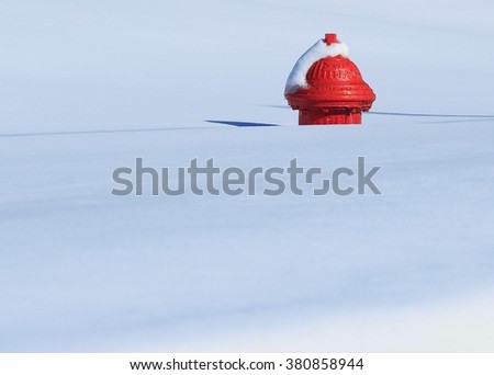 Fire hydrant poking up out of a deep snowfall