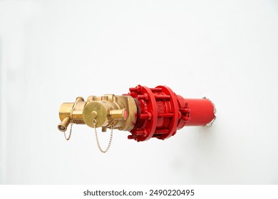 fire hydrant system powerful on the white cement wall