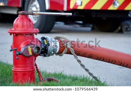 Fire Hydrant In Use During a Structure Fire