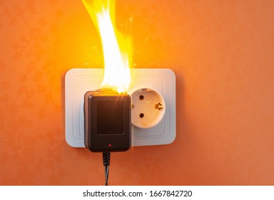 Fire Insurance, Concept. Defective Outlet And Electrical Short Circuit Is Cause Of Electrical Fire At Home.Motion Image, Selective Focus. 