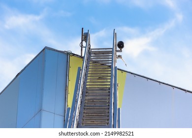 Fire Ladder Leading To The Roof Of A Building, Extinguishing A Fire In A Large Building.