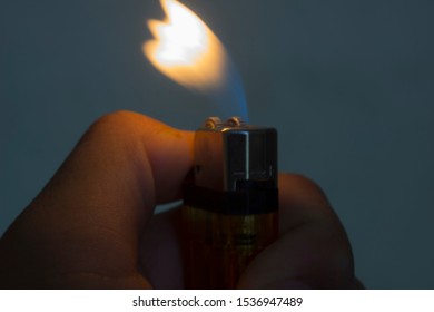 fire light in hand with blue background