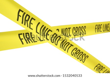 FIRE LINE - DO NOT CROSS. Isolated on White.  Fire Department Yellow Caution Tape. Warning Tape. Fire Line tape. Fire Department Warning. Work Site. Emergency Site. Do not enter. 