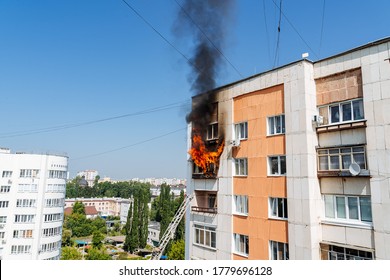 fire on the balcony of a multi-storey building, black clouds of smoke, apartment smoke, extinguishing fire in a residential building, fire escape, emergency