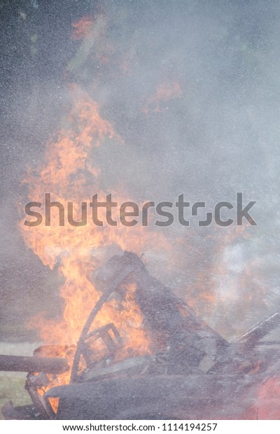 Fire on a burning car lpg ngv\
Gas-powered vehicles / Fire and rescue training school regularly to\
get ready - Help, Fire training exercise\
concept