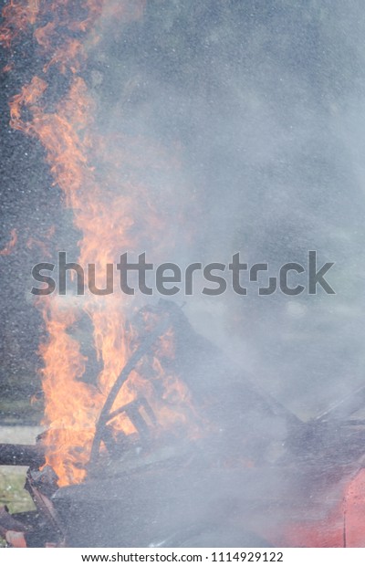 Fire on a burning car lpg ngv\
Gas-powered vehicles / Fire and rescue training school regularly to\
get ready - Help, Fire training exercise\
concept