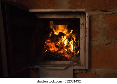 Fire In A Open Door Hearth Orange Brick Wall Close Up Selective Focus Copy Space