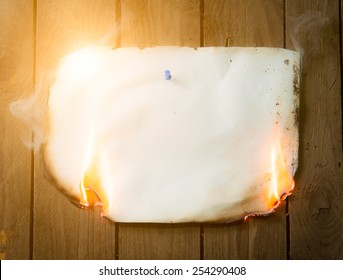 Fire Paper On Wooden Background