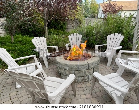 Fire in fire pit in the backyard of a residence in Calgary, Canada