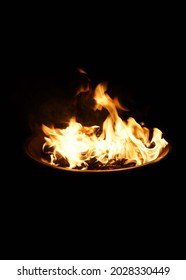Fire in a pit with black background