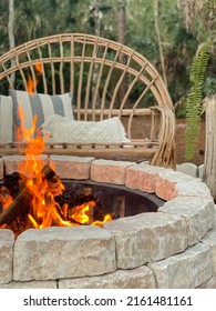 Fire Pit Bonfire Campsite In Tropical Backyard Woods With Rustic Wooden Branch Chairs Twinkle Lights Lantern Candles Palm Trees Stump Tables In Florida At Sunset