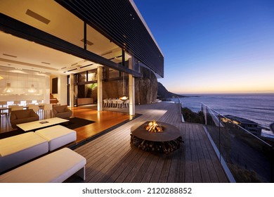 Fire pit on modern luxury home showcase beach house at sunset - Powered by Shutterstock