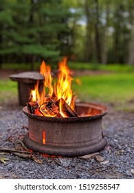 Fire pit in outdoor setting on summer evening.