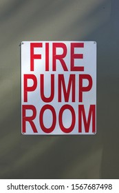 FIRE PUMP ROOM Sign On A Green Metal Side Door