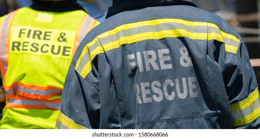 Fire And Rescue Personnel With Their High Visibility Jackets At An Accident Scene Concept Emergency Response People And Assistance