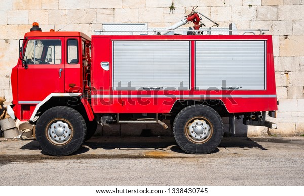 Fire rescue\
vehicle. Big red rescue car of\
Italy.