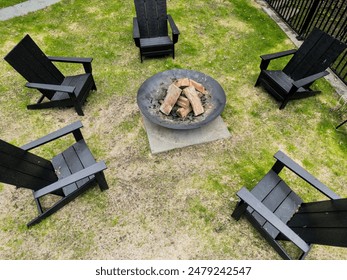 fire ring burning pit with chairs (outdoor firewood burn) campfire unlit country home camping recreation outdoors cooking outside - Powered by Shutterstock